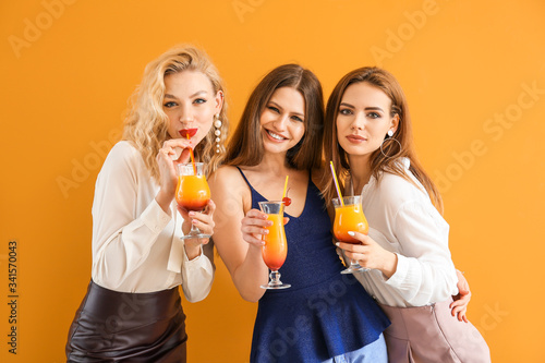 Happy women with cocktails ...