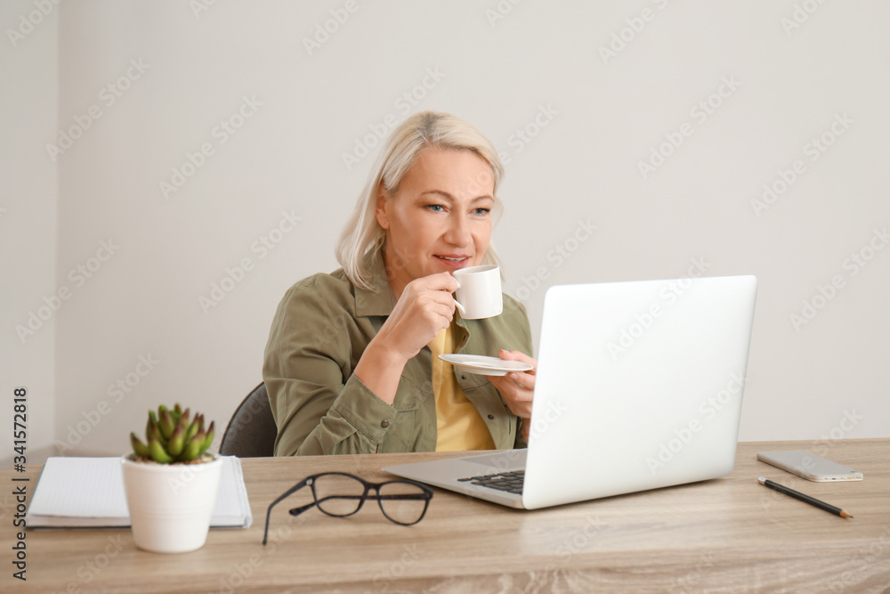 Mature woman using laptop for online learning at home Mature woman using laptop for online learning at home