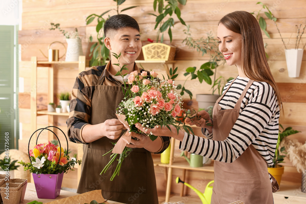 Florists working together in shop