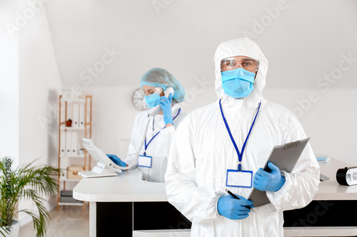 Doctor near reception desk ...