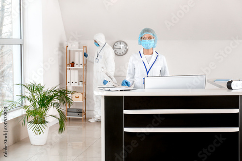 Female receptionist working...