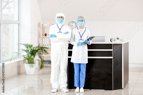 Receptionist with doctor in...