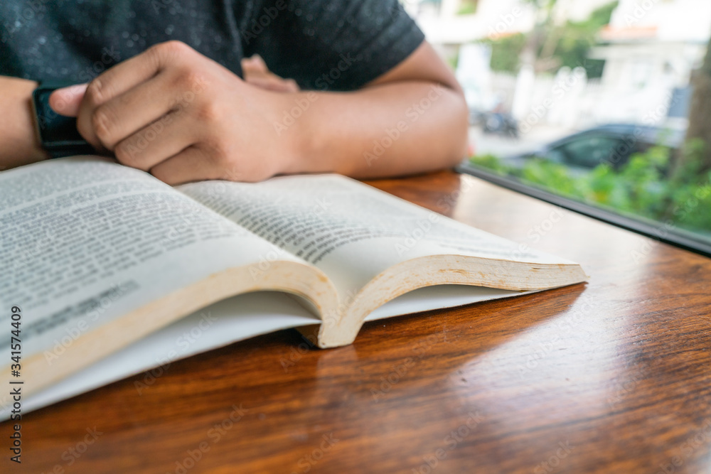 Close up photo of man reading book