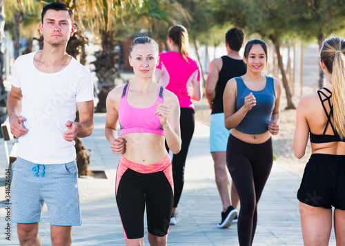 People jogging on city seafront