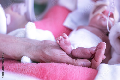 Newborn  in incubator ICU