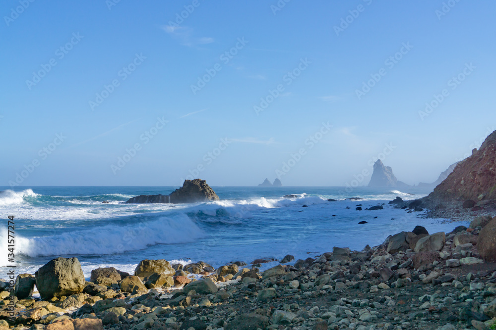 The rough Atlantic Ocean near Tenerife, Spain, strong waves break on the rocks in the water