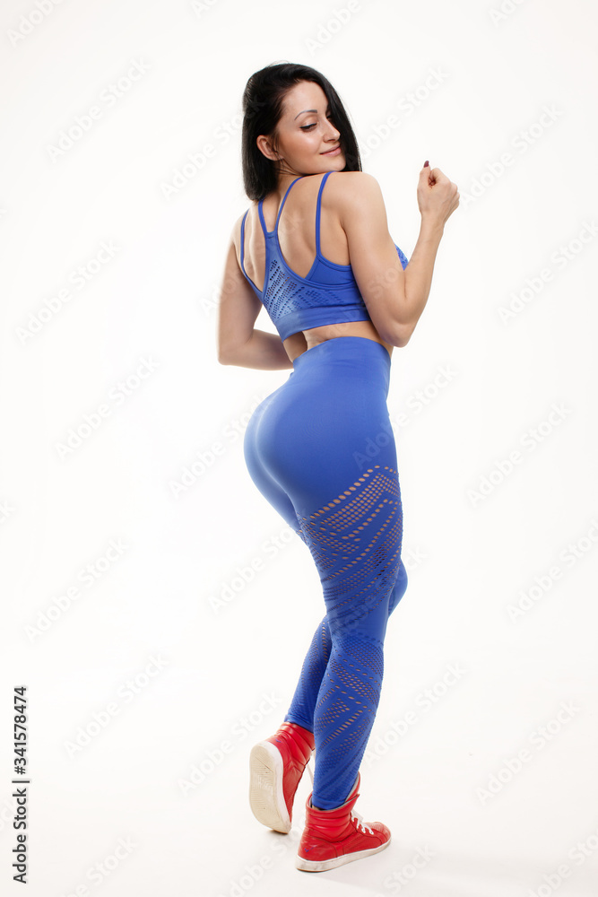 A big woman booty in leggings on white background. Stock Photo