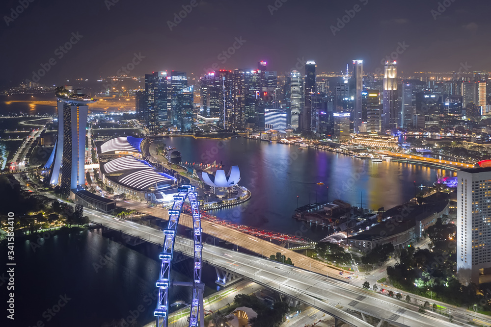 Fototapeta premium SINGAPORE - FEBRUARY 2: Aerial drone view of Singapore business district and city, Business and financial district Modern building in the city center of Singapore on February 2, 2020 in Singapore.
