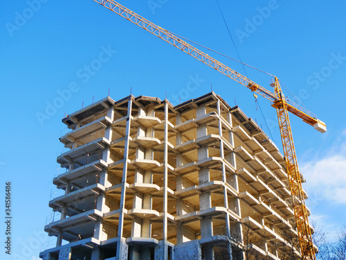 Construction site. Building site with crane. Concrete building under construction