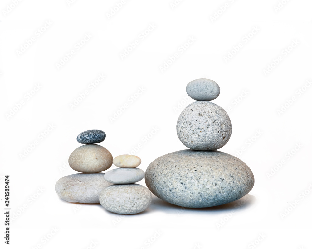 Group Of Smooth Pebble Stone Cairns On White Group Of Smooth Pebble Stone Cairns On White