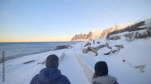 A Man and a Woman Walking Towards Tungeneset, a Norwegian Landmark, Slow Motion photo