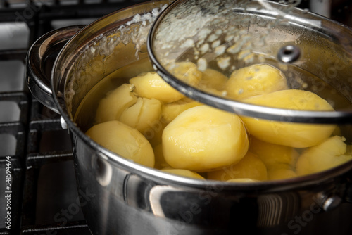 Potatoes are boiled on the stove.