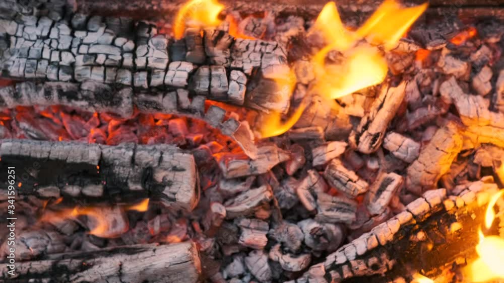 The background or texture of burning fire, smoke, wood, ash and coal. The background or texture of burning fire, smoke, wood, ash and coal.