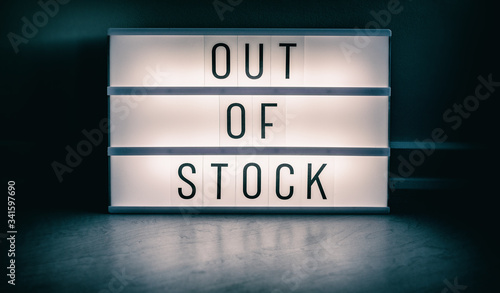 Covid-19 OUT OF STOCK store lightbox sign showing text message for shortage of PPE medical supplies. Coronavirus panic hoarding led to sold out shelves. shortage of hand sanitizer, mask products.