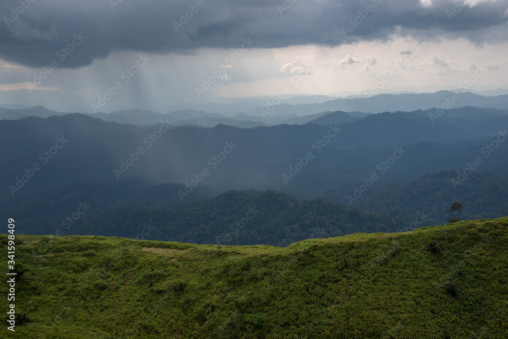 beautiful mountain landscape during a  rain and clouds