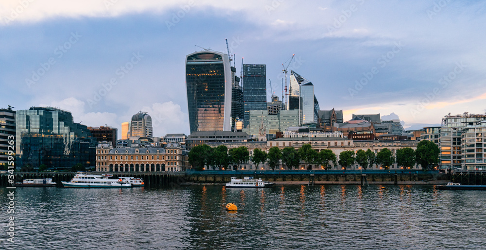 London, England - Skyline view of Bank Wharf, central London's leading financial districts with famous skyscrapers and other landmarks at sunset