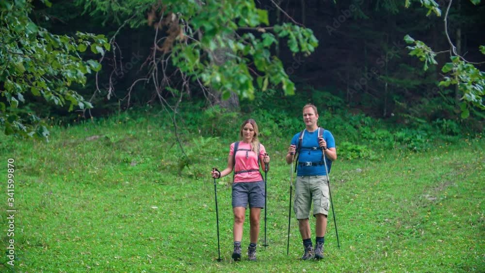 Slow motion of two hikers walking and exploring Slovenian nature Slow motion of two hikers walking and exploring Slovenian nature