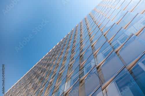 Glass facade of office building shining in sunlight