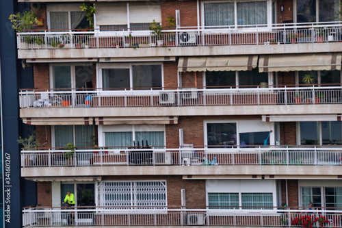 People in balcony during covid-19 confinement. Spain