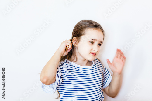 Wallpaper Mural girl with long hair combing hair, personal care, hairstyle, styling, comb and beauty, at home, home environment Torontodigital.ca