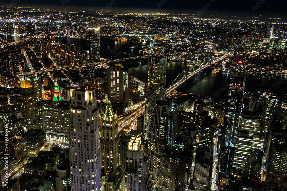 Naklejka premium Aerial view of the Lower East Side of Manhattan with Brooklyn in the background