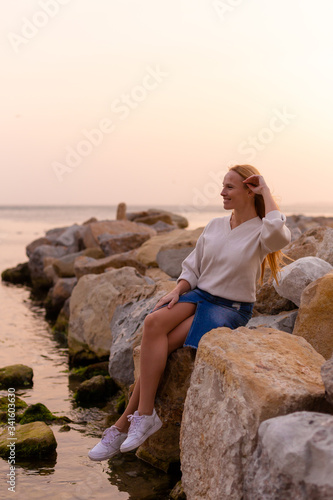 Blonde model on the beach at summer