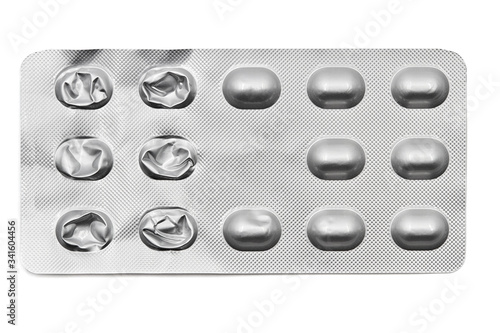 Used pills in blister pack isolated on white background. Global pharmaceutical industry. Closeup, top view