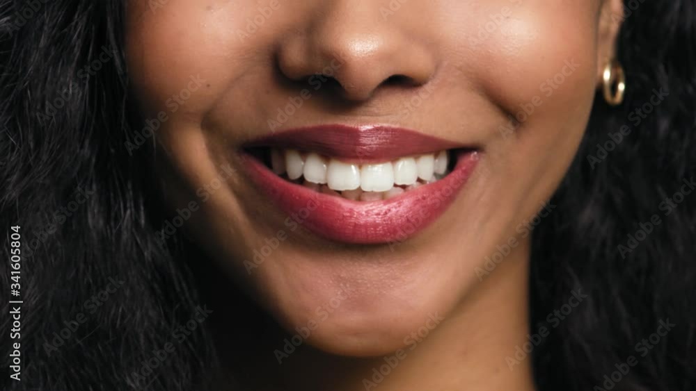Close up video of a smiling part the face of young woman. Shot with RED helium camera in 8K. Close up video of a smiling part the face of young woman. Shot with RED helium camera in 8K.