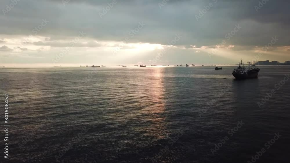 Marmara Sea Sunset, Istanbul Turkey. Aerial View of Cargo Ships Silhouettes and Sun Rays Over Horizon Marmara Sea Sunset, Istanbul Turkey. Aerial View of Cargo Ships Silhouettes and Sun Rays Over Horizon