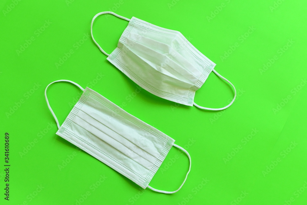 medical hygiene face mask on green background medical hygiene face mask on green background