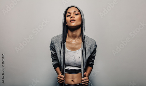 Tableau sur toile Fit woman wearing a hoodie sportwear