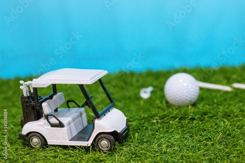 Golf cart is on green grass