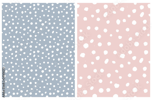Simple Rough Dotted Seamless Vector Patterns. White Hand Drawn Brush Dots Isolated on a Pale Blue and Pastel Pink Background. Infantile Style Geometric Repeatable Print. Irregular Polka Dots Backdrop.