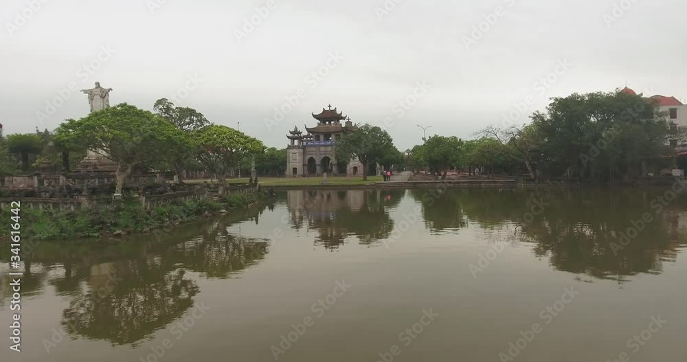 Phat Diem Cathedral, Ninh Binh, Vietnam. The church was built in stone in 1892, is an eclectic blend of Vietnamese and European architecture styles, the roofs is pagoda-type like traditional temple Phat Diem Cathedral, Ninh Binh, Vietnam. The church was built in stone in 1892, is an eclectic blend of Vietnamese and European architecture styles, the roofs is pagoda-type like traditional temple