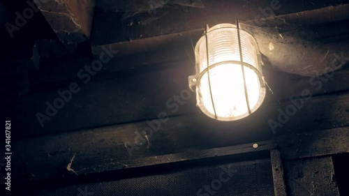 Mining lamp in dark hallway 4K. photo