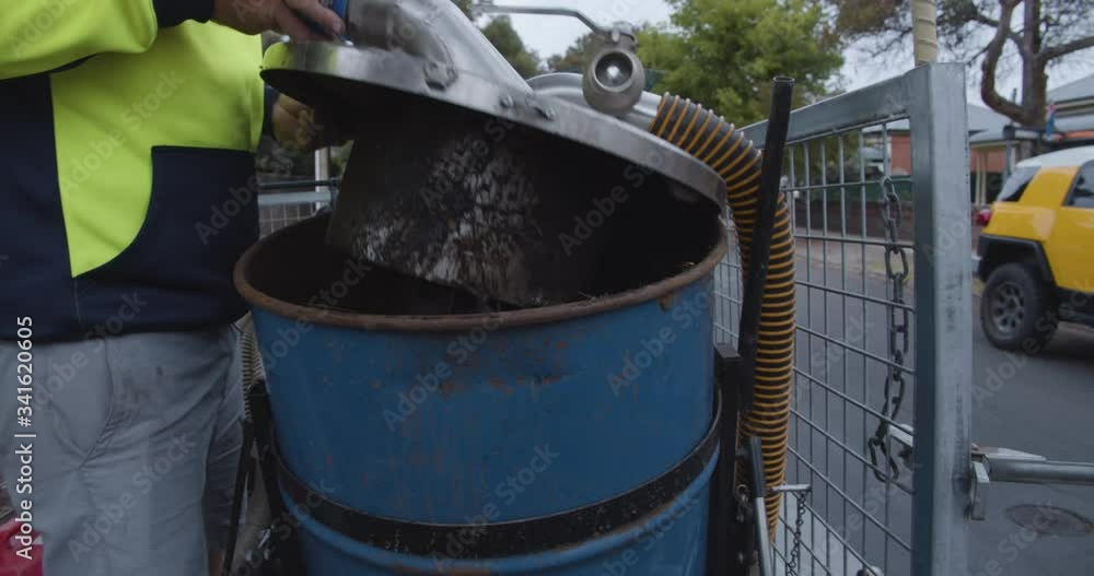 Plant litter in bin collected by gutter vacuum Plant litter in bin collected by gutter vacuum