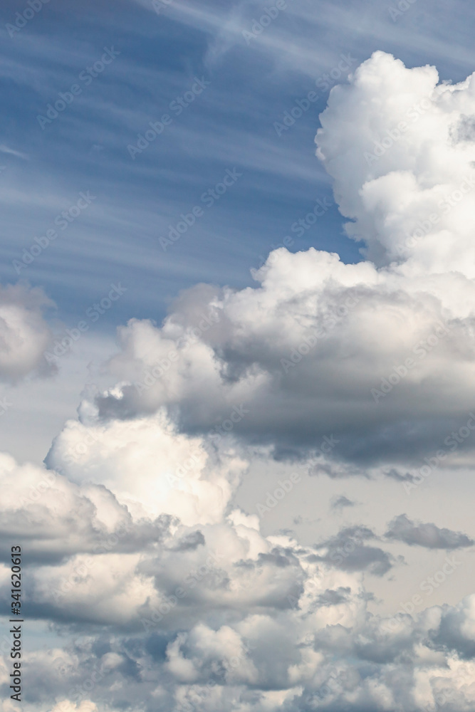 group of white cumulus clouds in the blue sky as a natural background group of white cumulus clouds in the blue sky as a natural background