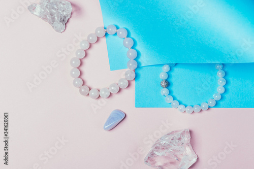 rose quartz semiprecious bracelet on pink background photo