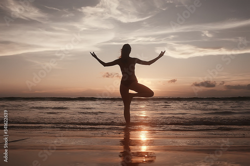 meditation and yoga on the beach   summer vacation concept health beauty  summer vacation yoga classes on the sea shore