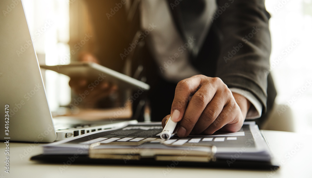business documents on office table with smart phone and digital tablet and graph financial and man working
business documents on office table with smart phone and digital tablet and graph financial and man working