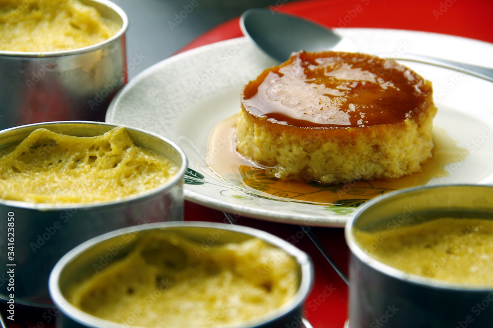 Photo of freshly cooked Leche Flan on a table. Photo of freshly cooked Leche Flan on a table.
