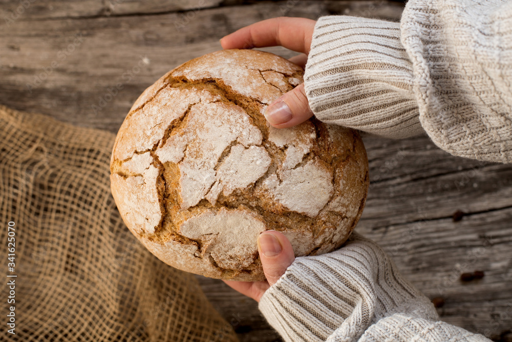 fresh home-made bread. rustic atmosphere. on the background of the old table