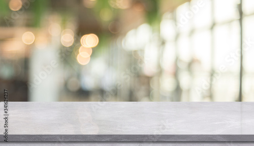 Empty Marble table top with light bokeh on blurred restaurant background