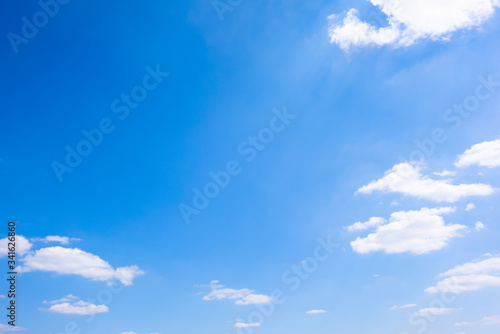 Beautiful blue summer sky with fluffy clouds as a background