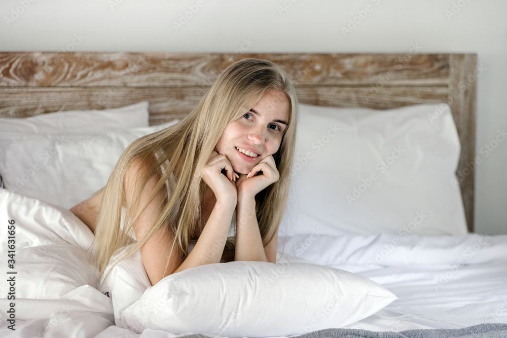 Young adult girl spending morning in cozy bedroom Young adult girl spending morning in cozy bedroom