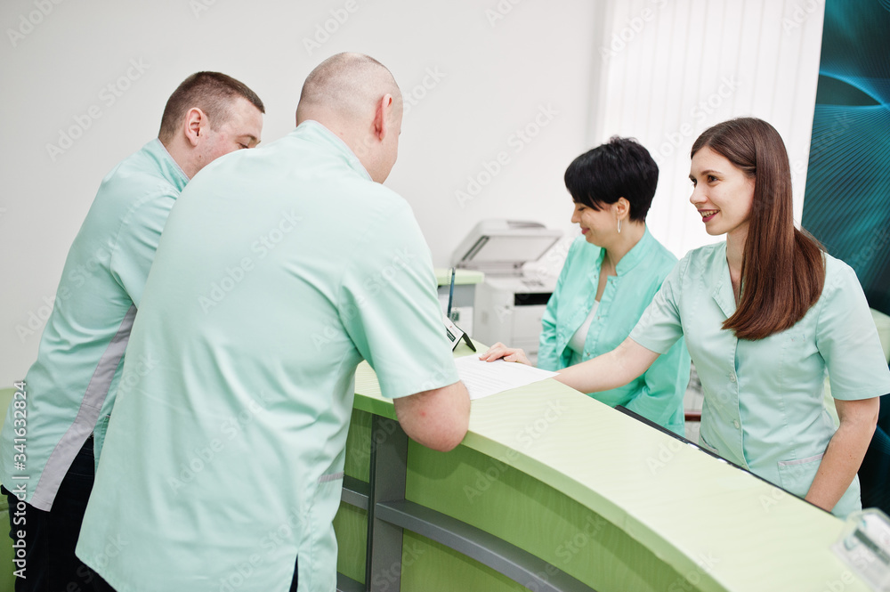 Medical theme. Group of doctors meeting at reception of diagnostic center in hospital. Medical theme. Group of doctors meeting at reception of diagnostic center in hospital.