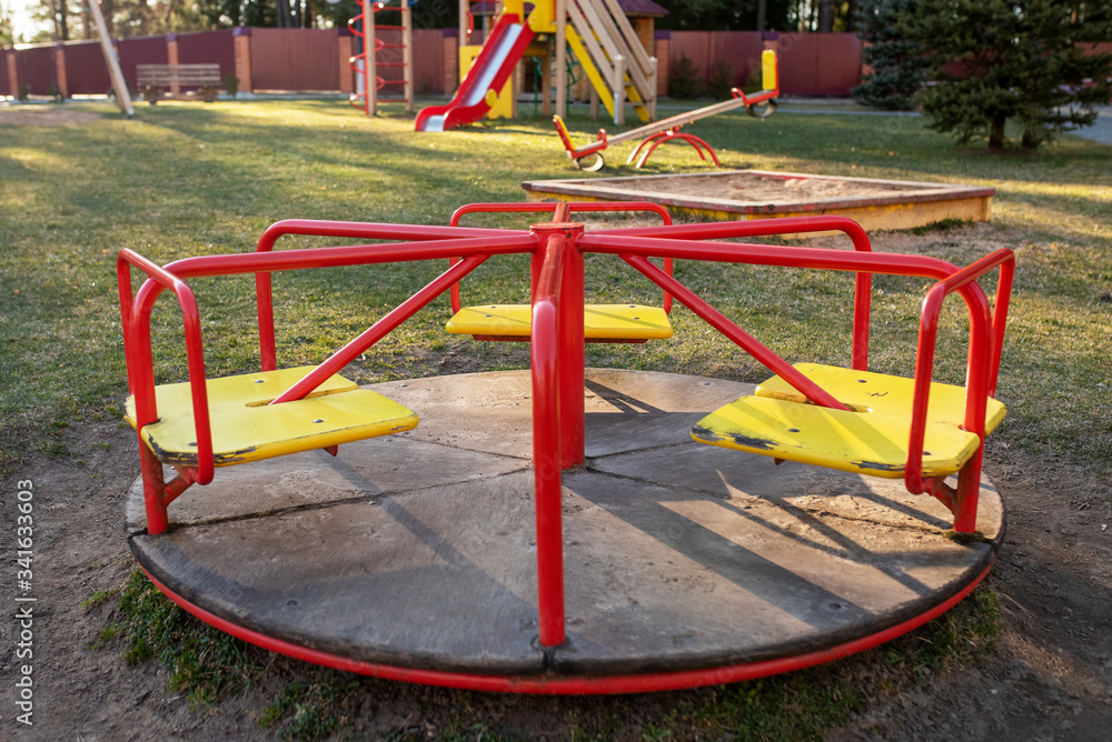 Children's carousel in the playground. In the woods. Children's carousel in the playground. In the woods.