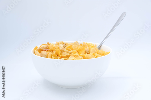 cereal in a white bowl on white background. Healthy breakfast concept.
