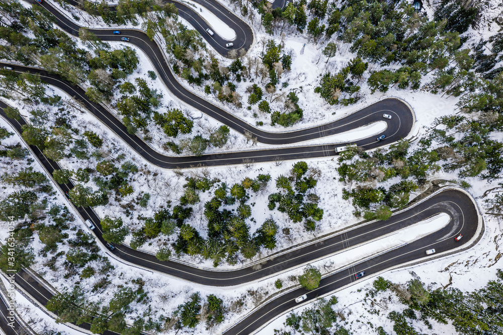 Aerial view of a car serpentine on a mountain