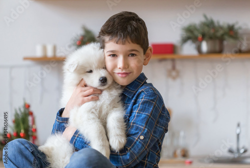 Fototapeta Naklejka Na Ścianę i Meble -   Boy, home, samoyed puppy, fun